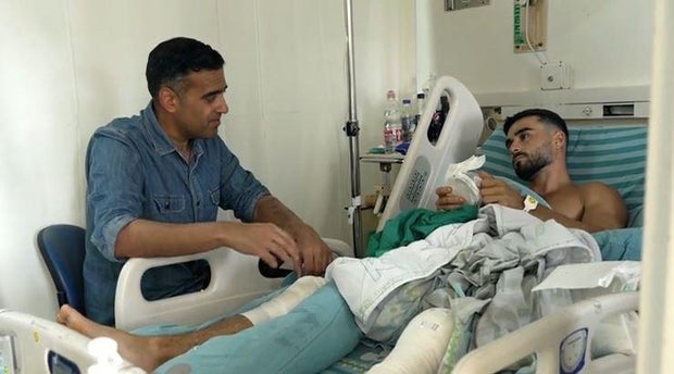 Gal Levy tells CBS News' Imtiaz Tyab about being shot by a Hamas militant as gunmen from the Palestinian faction stormed a music festival he was attending in southern Israel two days earlier, at a hospital in central Israel, Oct. 9, 2023