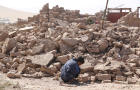 A boy cries as he sits next to debris in the aftermath of an earthquake in Zinda Jan, Afghanistan, Oct. 8, 2023. 