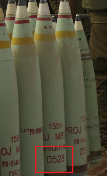This cropped version of the image above includes highlighting by Amnesty International to show what the rights group says is the U.S. Department of Defense Identification Code (DODIC) for white phosphorus-based rounds for artillery shells, on shells positioned by the Israeli military near the Gaza border on Oct. 9, 2023