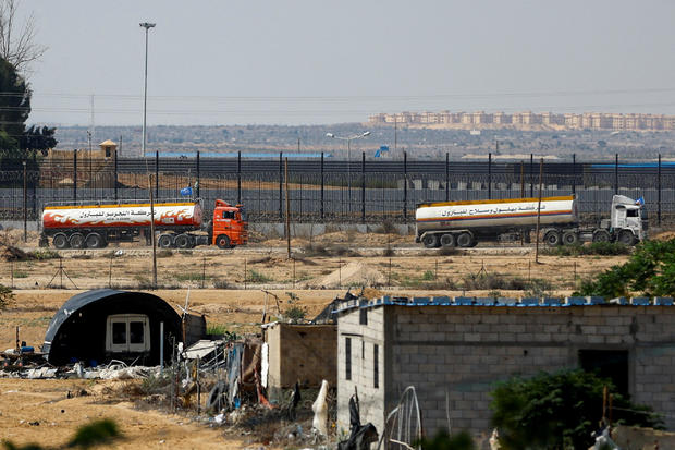 UN-flagged fuel trucks move towards border crossing in Gaza 
