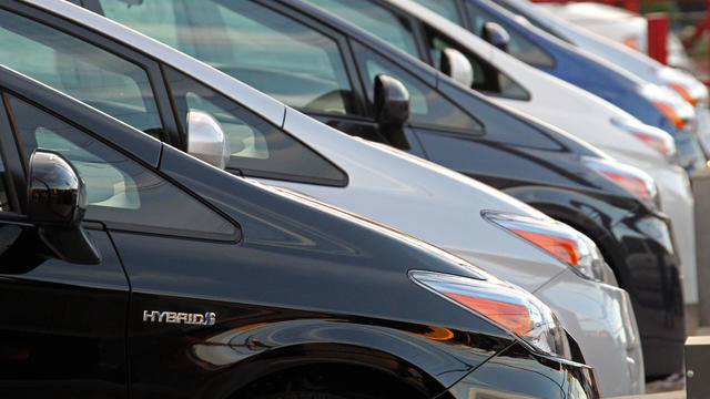 This Jan. 26, 2012 file photo shows Toyota hybrid gas-electric automobiles on display at a dealership in Los Angeles. 