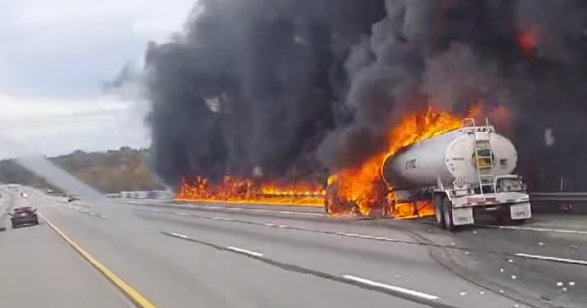 Driver taken to hospital after tractor-trailer catches fire in