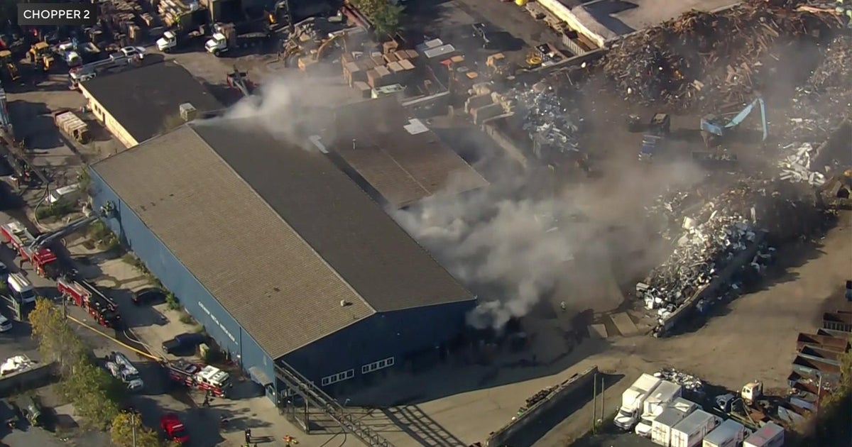 2 firefighters hurt after getting trapped inside burning warehouse on ...