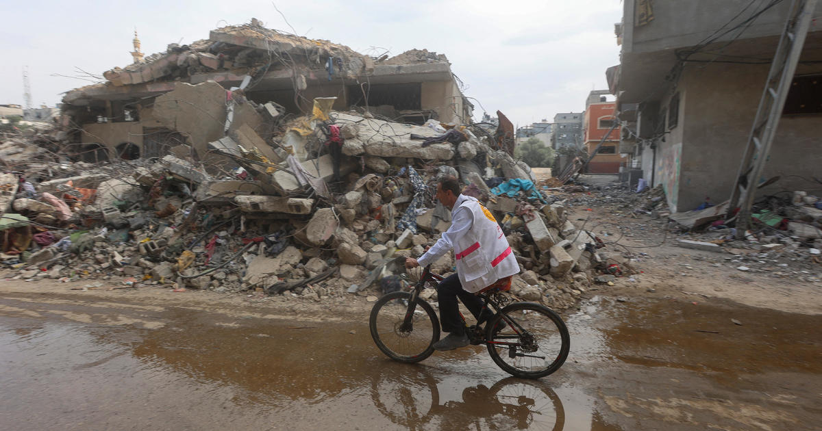 War took a Gaza physician’s automobile. Now he makes use of a motorbike to get to sufferers, generally carrying it over rubble.