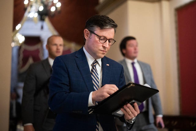 House Speaker Mike Johnson makes his way to a news conference in the U.S. Capitol on Nov. 7, 2023. 