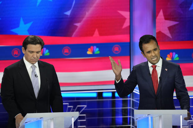 Republican presidential candidate businessman Vivek Ramaswamy speaks as Florida Gov. Ron DeSantis listens during a debate hosted by NBC News on Nov. 8, 2023, in Miami. 