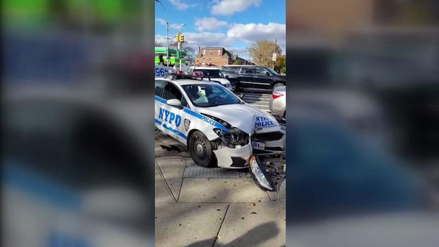 An NYPD car with front-end damage. 