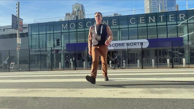 APEC volunteer outside Moscone Center 