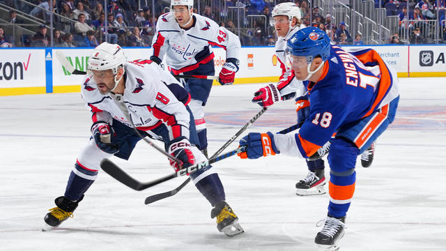 Pierre Engvall #18 of the New York Islanders is defended by Alex Ovechkin #8 of the Washington Capitals during the first period at UBS Arena on November 11, 2023 in Elmont, New York. 