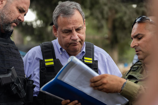 Chris Christie reacts to photos of people killed during the attack by Hamas on Oct. 7 at Kibbutz Kfar Aza on November 12, 2023, in Kfar Aza, Israel. 