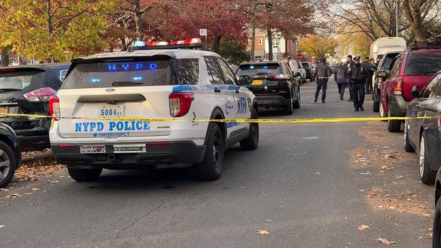 Crime scene tape blocks off a Queens street. 