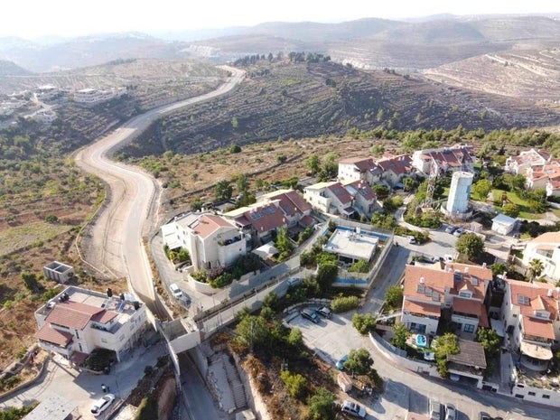 An aerial photo shows Sa'adat Gharib's family home, surrounded by a high security fence in the middle of an Israeli settlement in East Jerusalem, Nov. 9, 2023