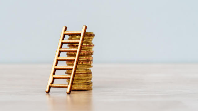 Ladder on Stack of Coins 