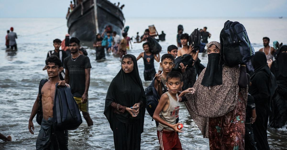 Boat crammed with Rohingya refugees, including women and children, sent back to sea in Indonesia