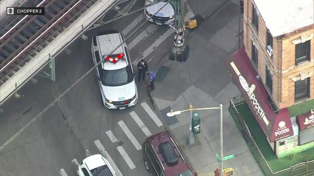 An aerial view of an NYPD vehicle on a Brooklyn street corner. 