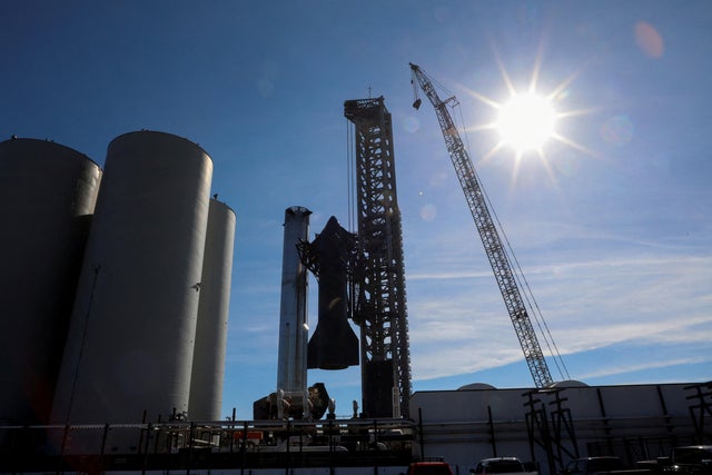 SpaceX's next-generation Starship spacecraft is removed from atop its Super Heavy rocket as it is prepared for launch 