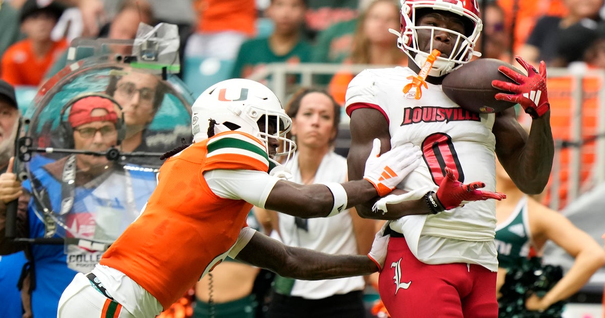 No. 9 Louisville tops Miami 38-31 to clinch location in the ACC championship game No. 9 Louisville tops Miami 38-31 to clinch location in the ACC championship game