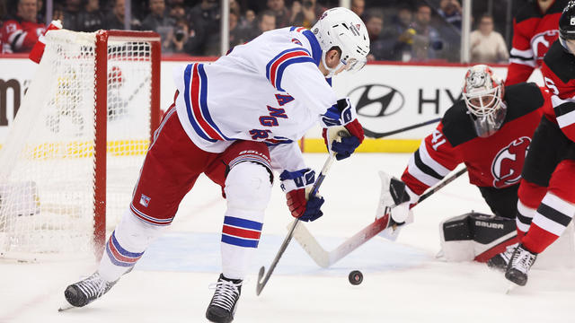 New York Rangers left wing Jimmy Vesey (26) scores a goal on New Jersey Devils goaltender Vitek Vanecek (41) during a game between the New York Rangers and New Jersey Devils on November 18, 2023 at Prudential Center in the Newark, New Jersey. 
