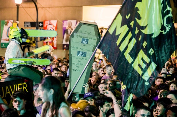 Supporters of Javier Milei celebrate the results of the presidential election runoff outside the party headquarters in Buenos Aires on November 19, 2023.