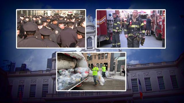 File images of NYPD officers, FDNY firefighters and DSNY employees. 