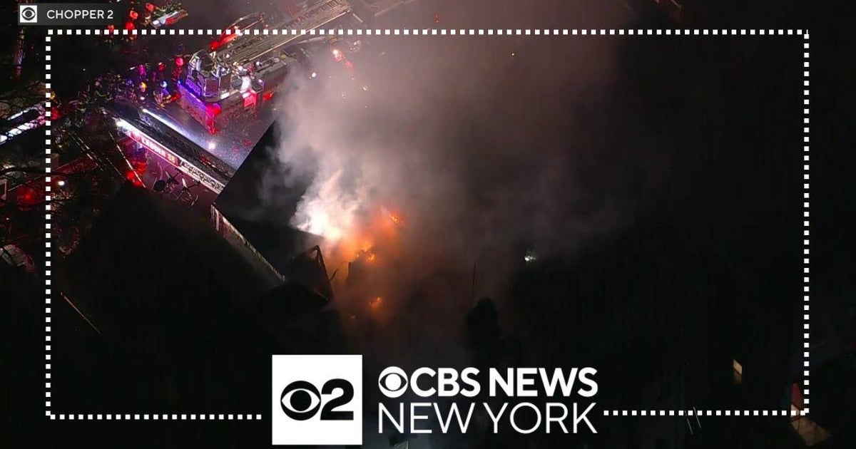 FDNY battling Bronx fire after it spread to 2 homes - CBS New York