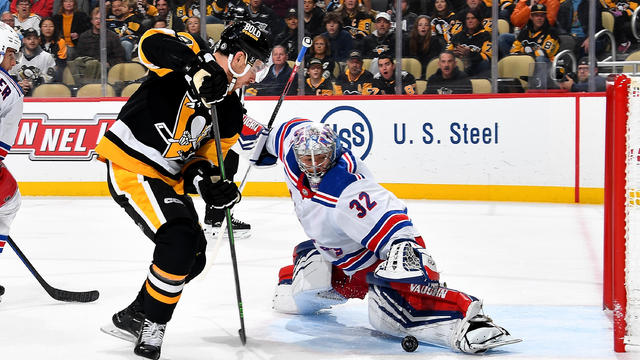 Jonathan Quick #32 of the New York Rangers makes a save against Reilly Smith #19 of the Pittsburgh Penguins at PPG PAINTS Arena on November 22, 2023 in Pittsburgh, Pennsylvania. 