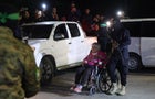 Israeli hostages on board Red Cross vehicles on route the Rafah crossing to Egypt 