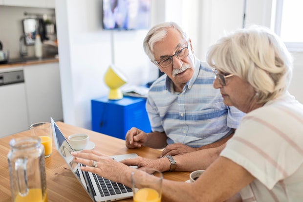 Couple's Laptop Usage Over Breakfast 