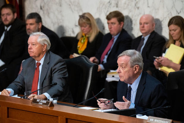 Senate Judiciary Committee Chairman Richard Durbin speaks as ranking member Lindsey Graham listens during a committee meeting on Thursday, Nov. 30, 2023. 