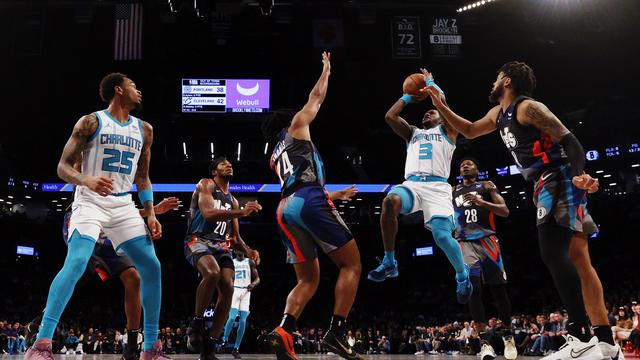 Terry Rozier #3 of the Charlotte Hornets shoots the ball as Cam Thomas #24 and Trendon Watford #9 of the Brooklyn Nets defend during the game at Barclays Center on November 30, 2023 in the Brooklyn borough of New York City. 