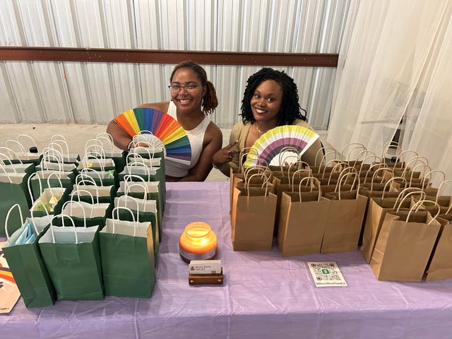 San Antonio college students Limya Harvey (left) and Cydney Mumford (right) distribute free kits 