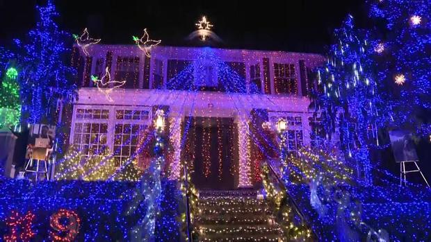 The home of Billy and Karen Santo in Brooklyn covered in elaborate Christmas lights and decorations. 