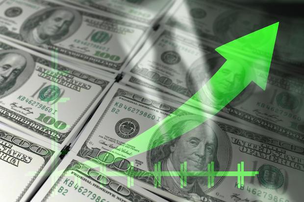 Economy graph: green rising arrow and dollar bills. 