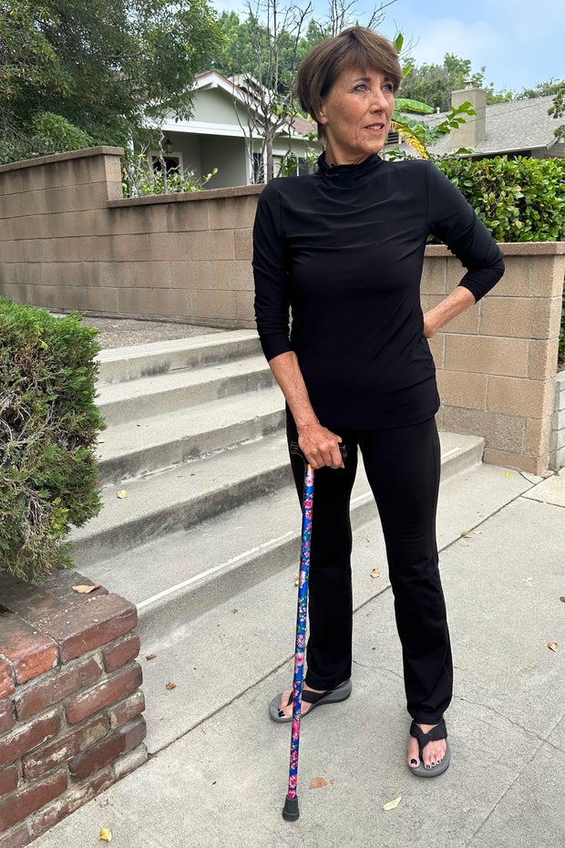 Kristin Biorn standing with a cane