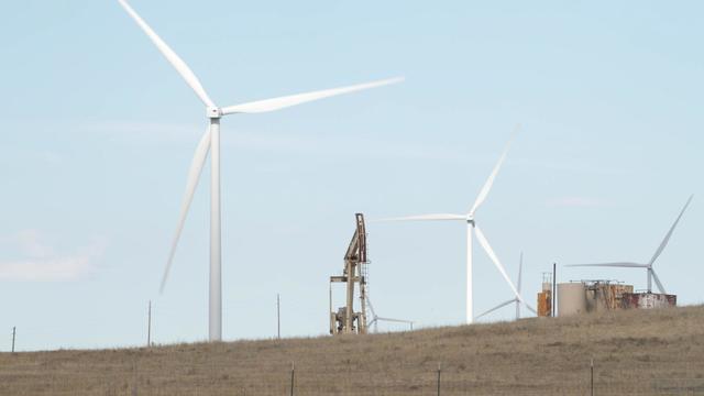 Wind turbines and an oil rig in Wyoming 