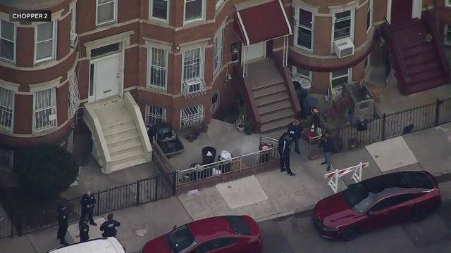 An aerial view of police outside homes in Brooklyn. 