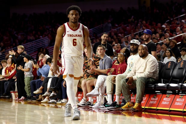 LeBron James looks on from the stands towards Bronny James at Galen Center on December 10, 2023, in Los Angeles, California.