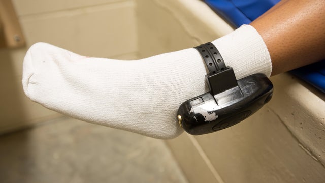 Teen showing ankle monitor 