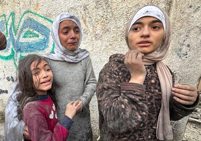 Children react following an Israeli airstrike in Rafah, in the southern Gaza Strip, Dec. 12, 2023. 