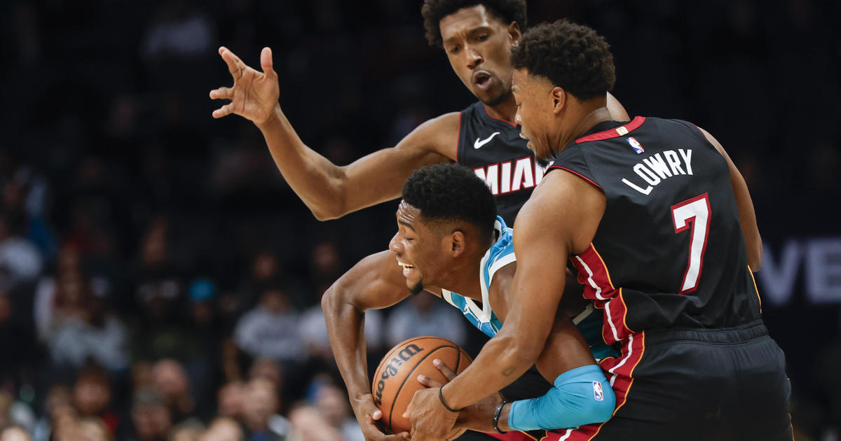 Heat dangle on to conquer Hornets 116-114