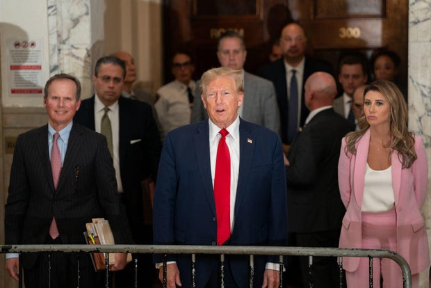 Flanked by his attorneys, former President Donald Trump speaks to the media while attending his trial in New York State Supreme Court on Dec. 7, 2023.