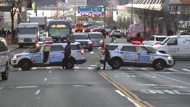 Two NYPD vehicles block off 57th Street in Hell's Kitchen. 