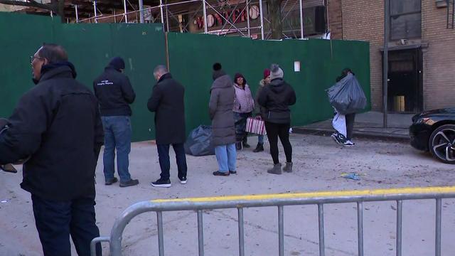 Police stand outside a partially collapsed Bronx building. 