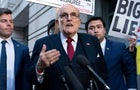 Rudy Giuliani speaks to reporters outside the federal courthouse in Washington, D.C., on Friday, Dec. 15, 2023. 