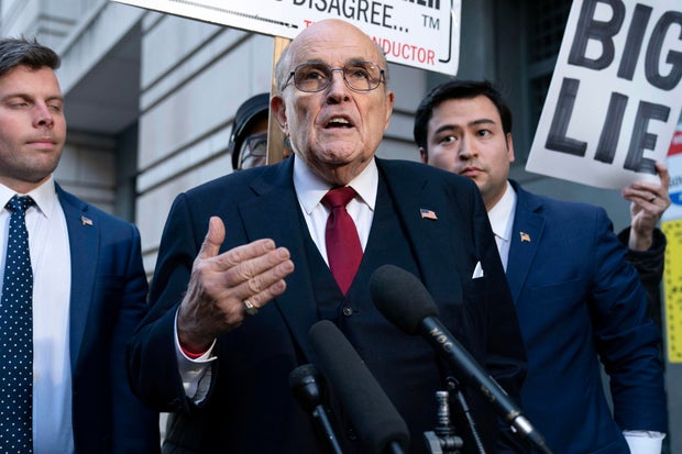Rudy Giuliani speaks to reporters outside the federal courthouse in Washington, D.C., on Friday, Dec. 15, 2023.