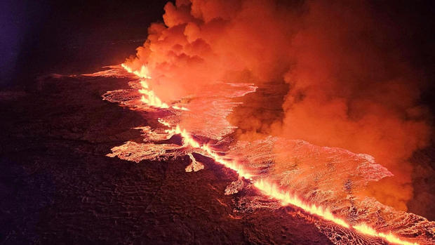A volcano spews lava and smoke as it erupts in Grindavik, Iceland 