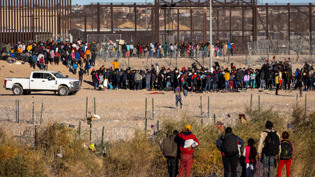Migrants at US-Mexico border during International Migrant Day 