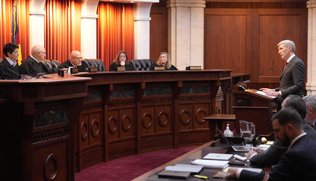 Attorney Eric Olson, far right, argues before the Colorado Supreme Court on Wednesday, Dec. 6, 2023, in Denver. 