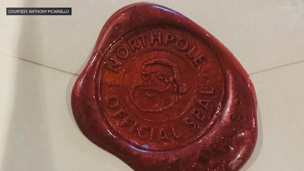 The red wax seal Stitch puts on his letters, it says North Pole, Official Seal 