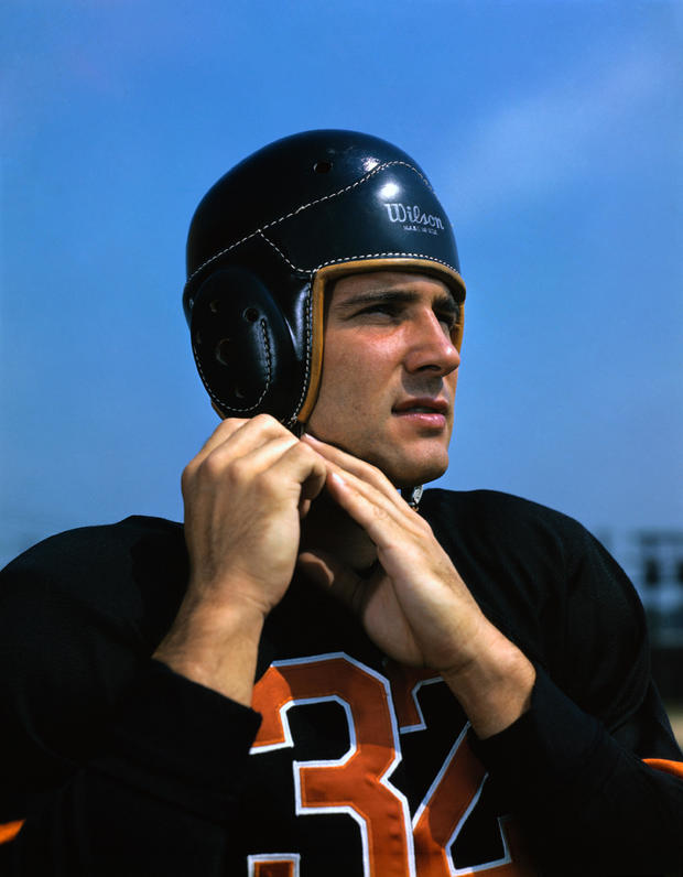 Johnny Lujack Adjusting Helmet 